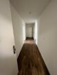 Moderne 1,5-Zimmer-Neubauwohnung mit Terrasse und Garten in Nauen - Flur
