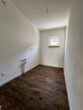 Moderne 1,5-Zimmer-Neubauwohnung mit Terrasse und Garten in Nauen - Küche