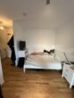 Gepflegte 1-Zimmer-Wohnung mit Terrasse sucht Nachmieter - Schlafbereich in Wohnzimmer