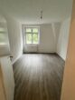 Erstbezug nach Renovierung! Helle 2,5-Zimmer-Wohnung im schönen Luisenhof von Essen-Frohnhausen zu vermieten - Wohnzimmer