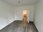 Erstbezug nach Renovierung! Helle 2,5-Zimmer-Wohnung im schönen Luisenhof von Essen-Frohnhausen zu vermieten - Wohnzimmer
