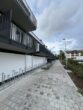 Erstbezug in ein vollmöbliertes Neubau-Apartment im Erdgeschoss mit einer Terrasse zu vermieten - Zuwegung