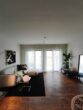 Moderne 1-Zimmer-Neubauwohnung mit Terrasse und Garten in Nauen - Wohnzimmer